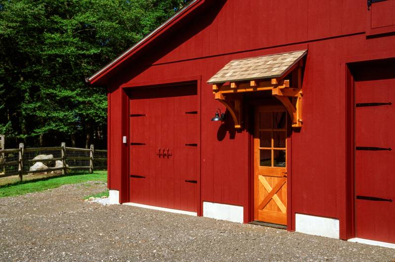 4' Timber Frame Eyebrow Roof above Spanish cedar entry door