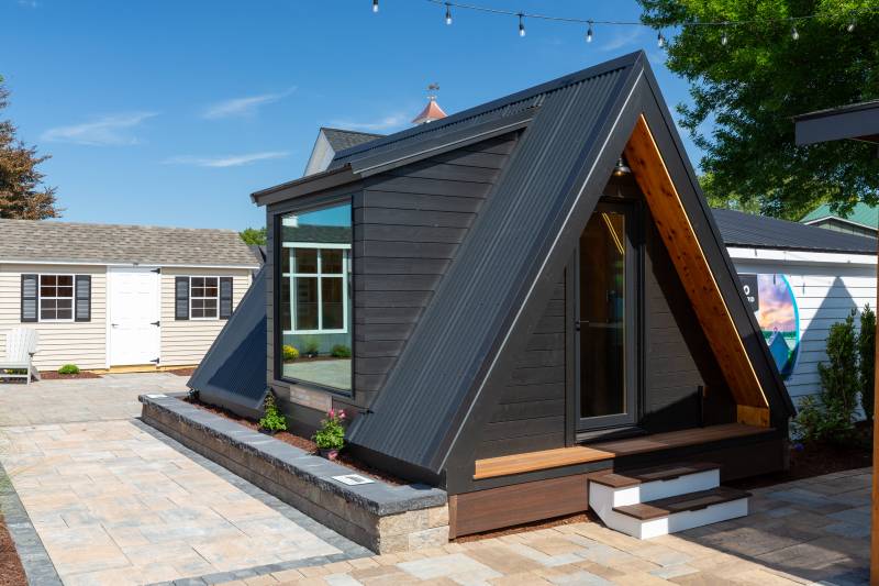 Corrugated Metal Roof • Thermory Ignite Exterior Siding • Andersen Series Full View Patio Door