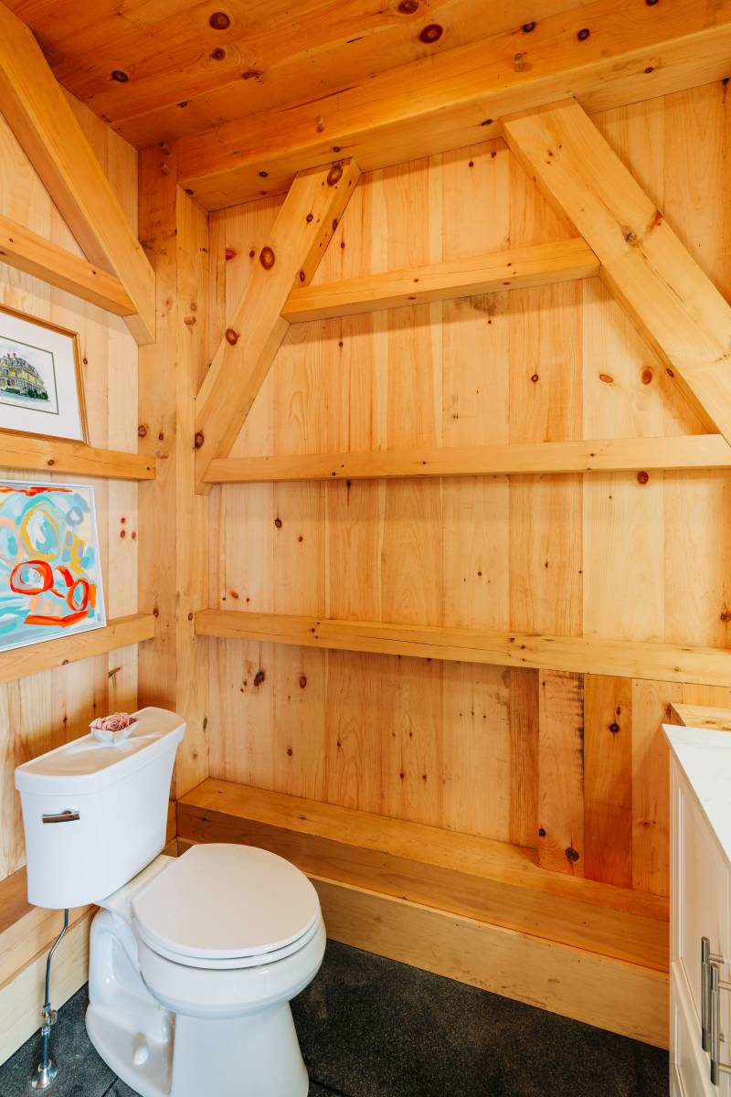 The bathroom inside the post & beam pool house