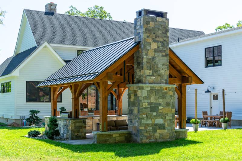 The back of the pavilion • Stone fireplace by others • post & beam pavilion outdoor living