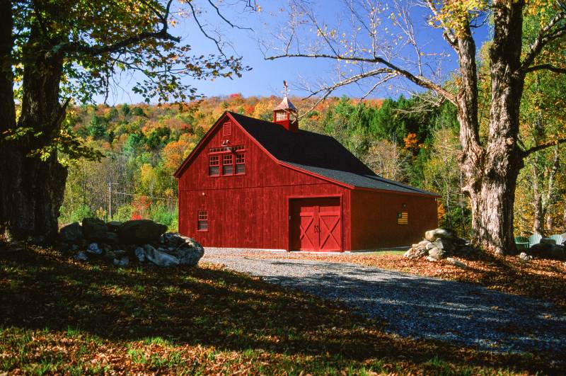 10-12 Roof Pitch • Pine Copper Top Cupola • red barn off a small gravel road in Vermont surrounded by fall colors