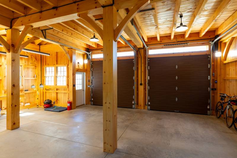 Two Overhead Doors • Entry Door on the Right • post & beam timber frame carriage barn garage