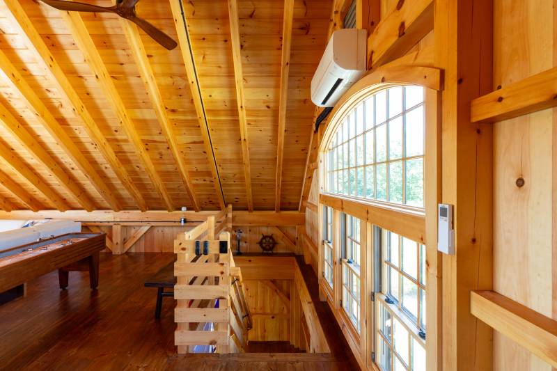 The top of the stairs in the second floor loft • barn with loft authentic post & beam
