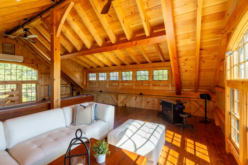 The loft is the ideal hangout spot for family & friends • post & beam timber frame barn
