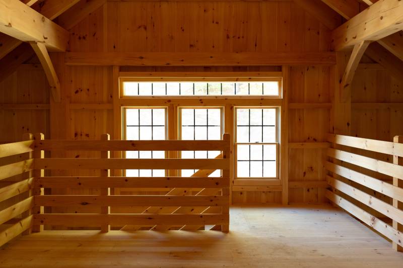 The top of the stairs leading to the post & beam barn’s center aisle loft