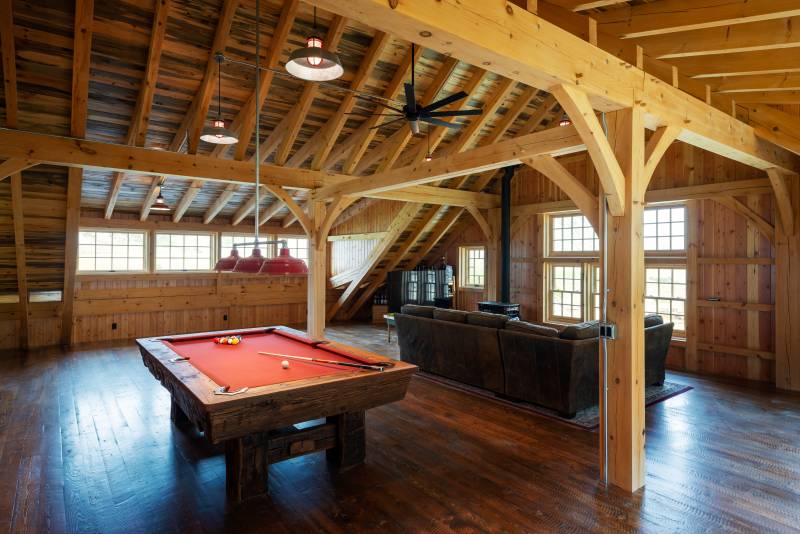 A seating area in the loft looks out over the landscape