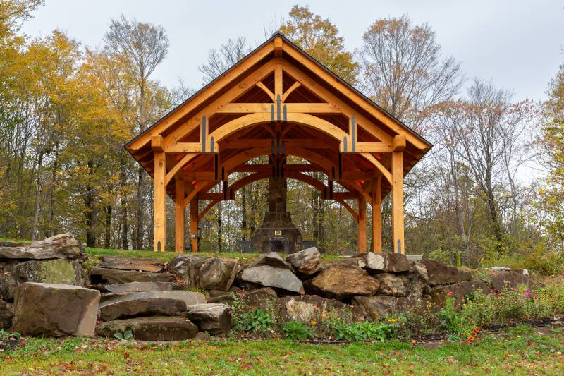 Hammer Beam Timber Truss Design with Powder Coated Steel Strapping