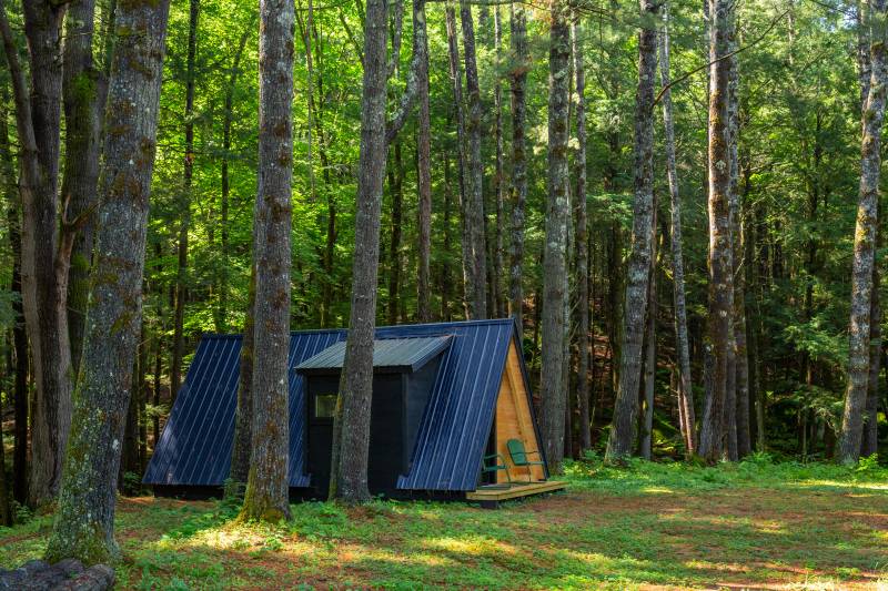 The cabin is nestled in the woods of Chesterfield, MA