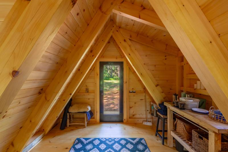 Looking towards the cabin’s entry from the bed