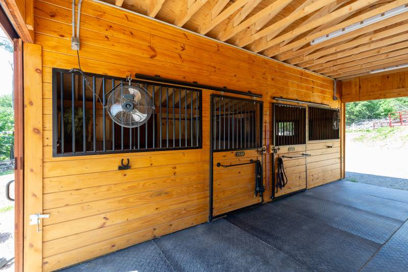 Two stalls on one side of the barn are home to the horses