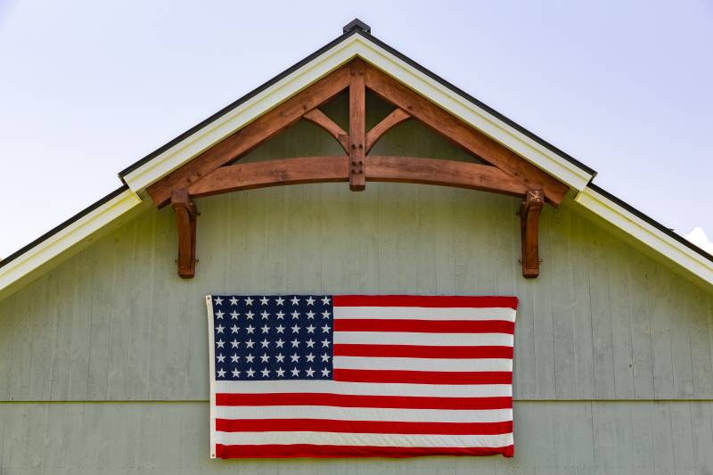Turkey tail peak with timber frame gable accent