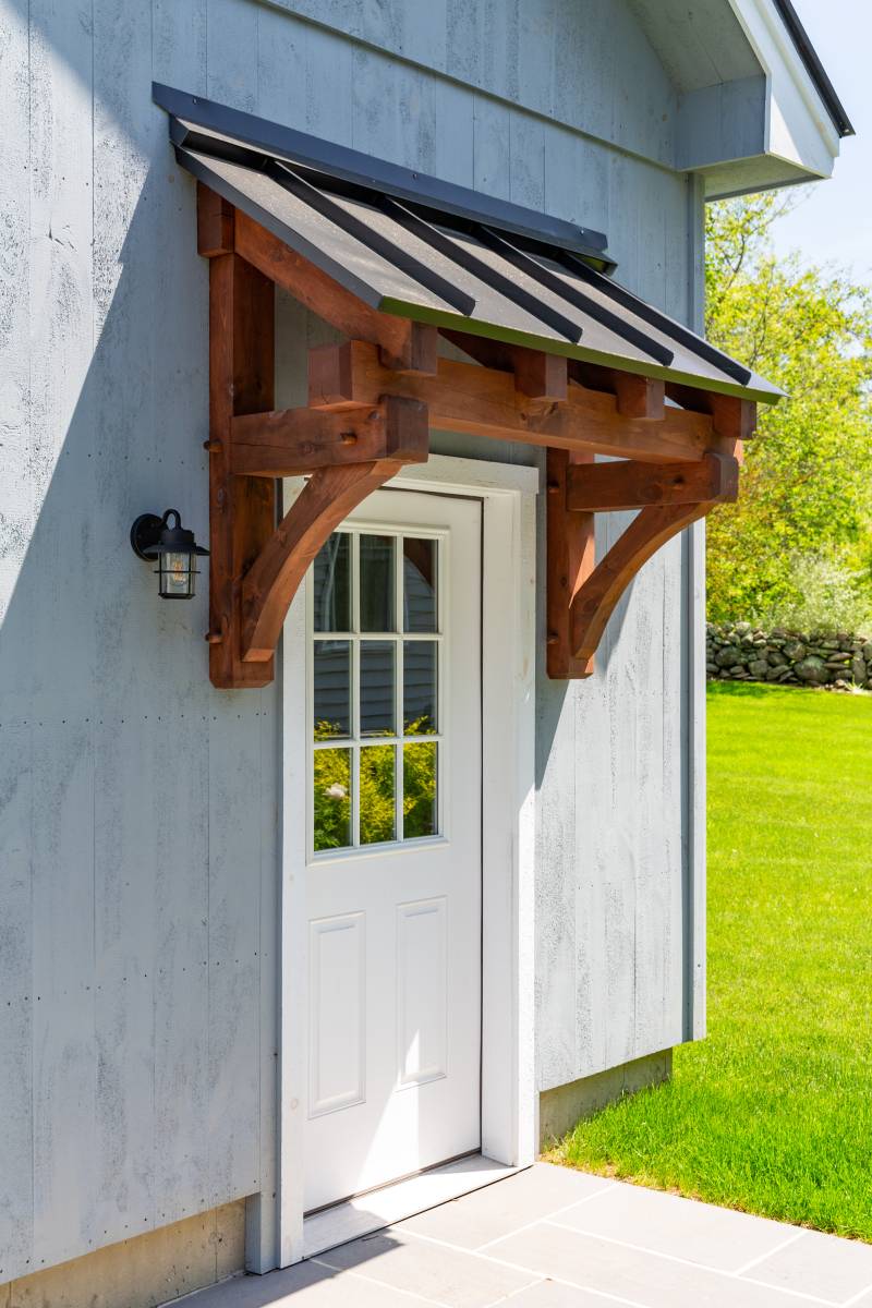 4' timber frame eyebrow roof above Thermatru entry door