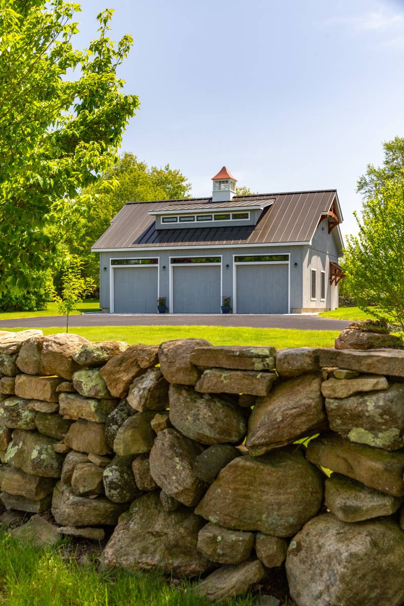 Refined details elevate the exterior of this single-story garage