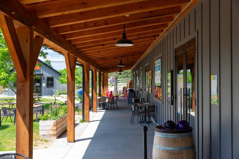 Underneath the open lean-to overhang