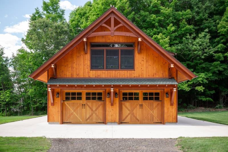 Andersen Series windows • Spanish Cedar Overhead Doors • Vertical Shiplap Pine Siding