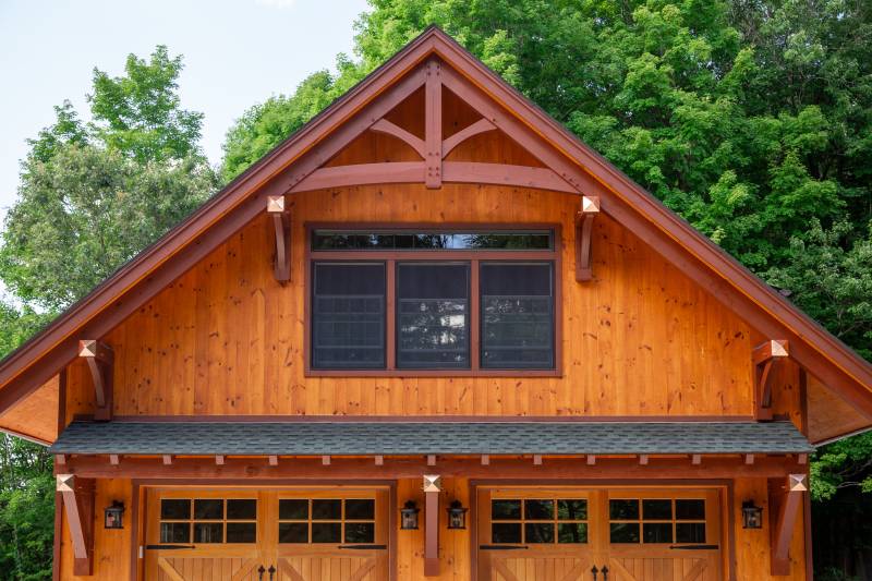 Timber Truss Accent with Show Rafter • 28' Big Sky Timber Frame Eyebrow Roof