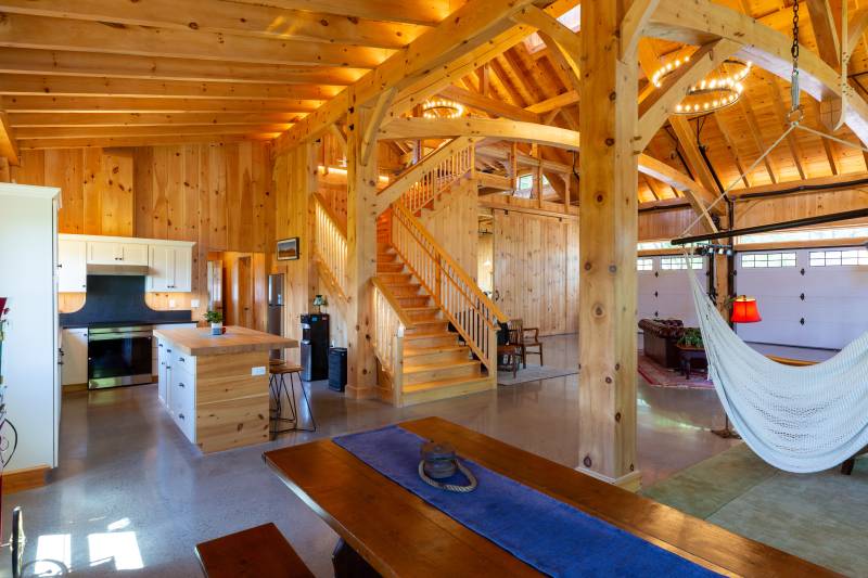 Kitchen and guest area on the left • Stairs to loft in center • Entertainment area on the right