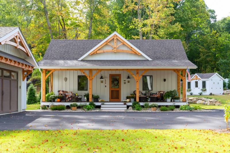 The Asheville ADU has a timber frame porch & timber gable accent