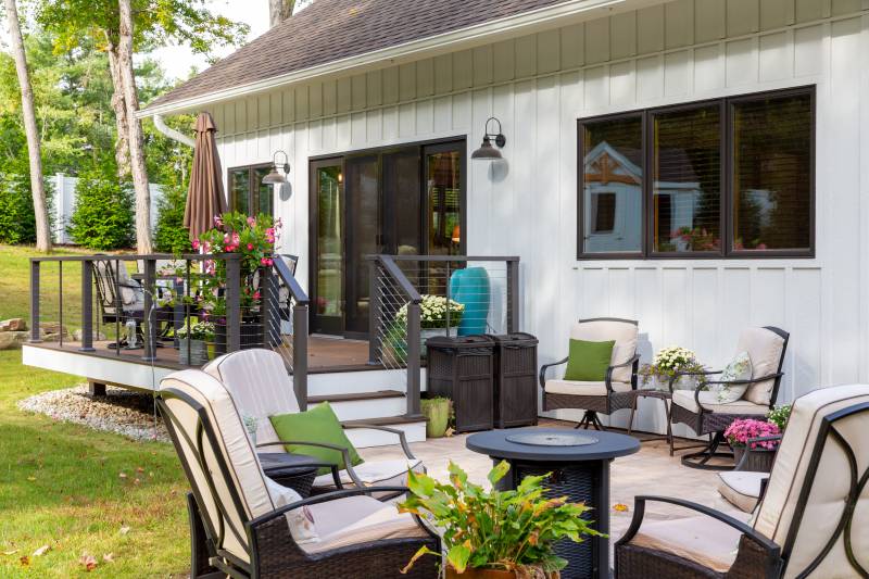 A seating area on the patio leading up to the deck