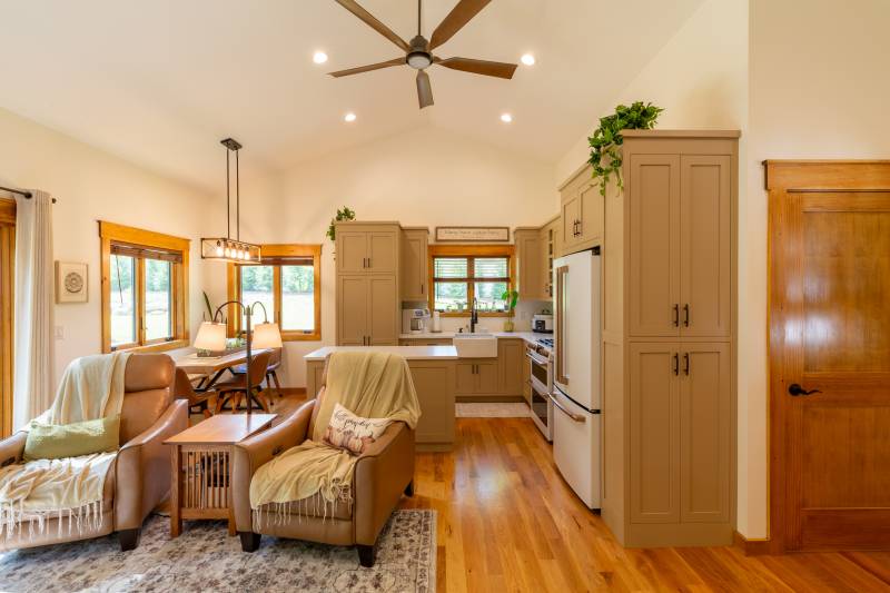 The spacious interior has a full kitchen, dining area, and living space