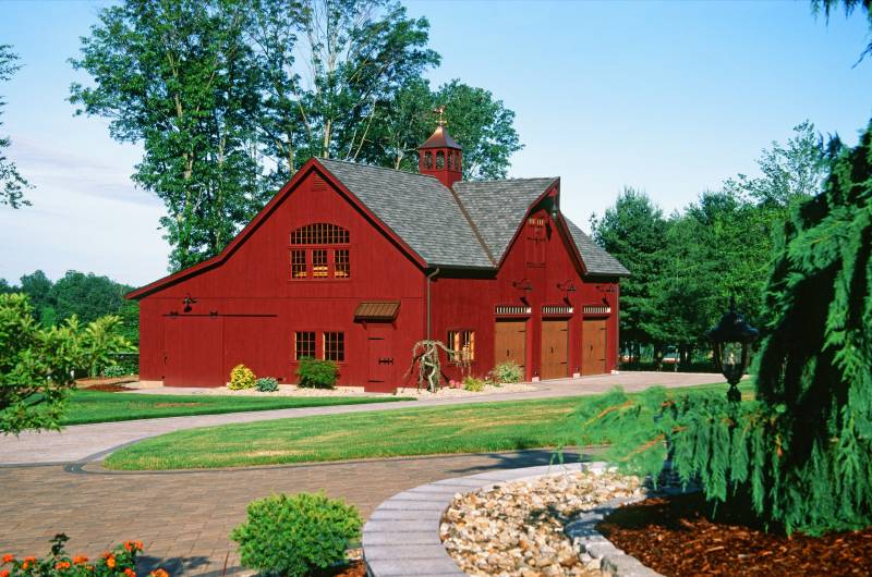 The iconic Carriage Barn silhouette fits in well on the New England property
