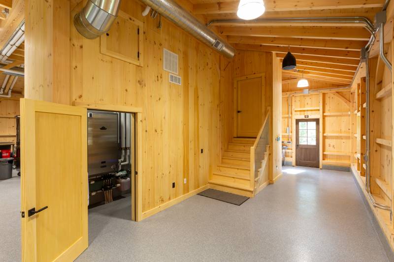 Enclosed mechanical room • Stairs & entry to the second floor loft