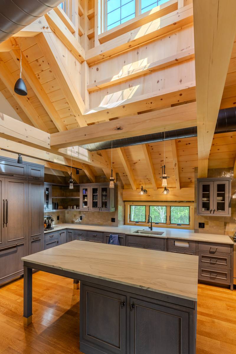 The functional timber frame cupola is directly above the kitchen island