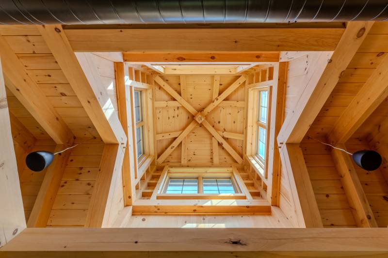 Looking up at the functional timber frame cupola