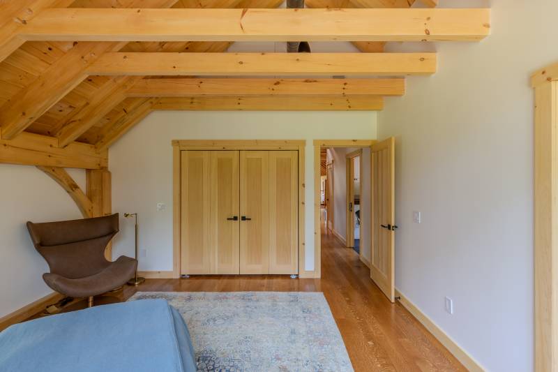 The bedroom is spacious, with a large closet