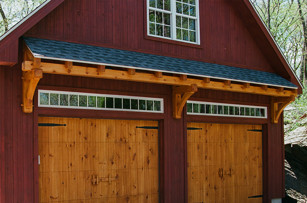Timber Frame Eyebrow Roof Above Overhead Door