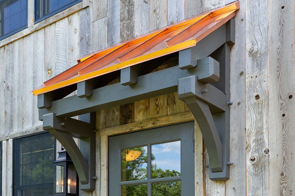 Timber Frame Eyebrow Roof Above Entry Door