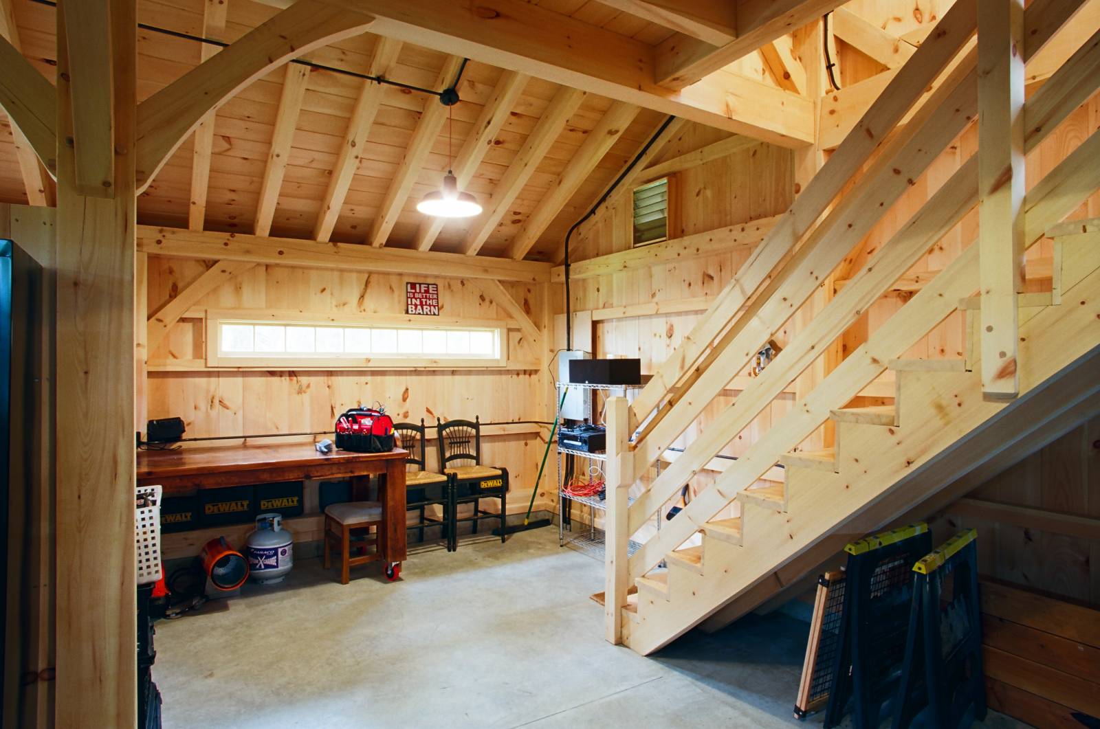 Looking towards the workshop in the lean-to portion of the post & beam barn interior