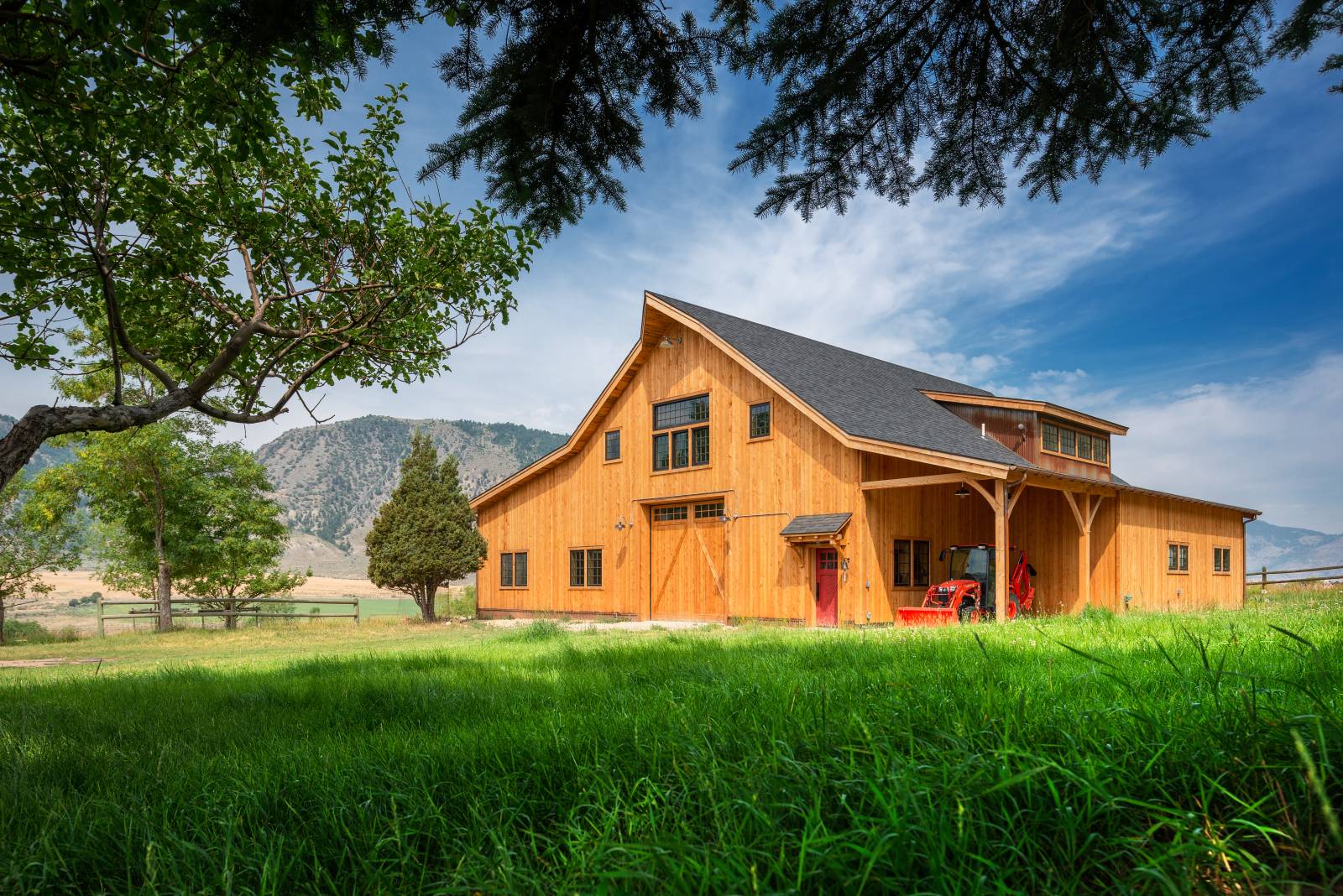 The barn, framed by Montana’s Gallatin Mountain Range