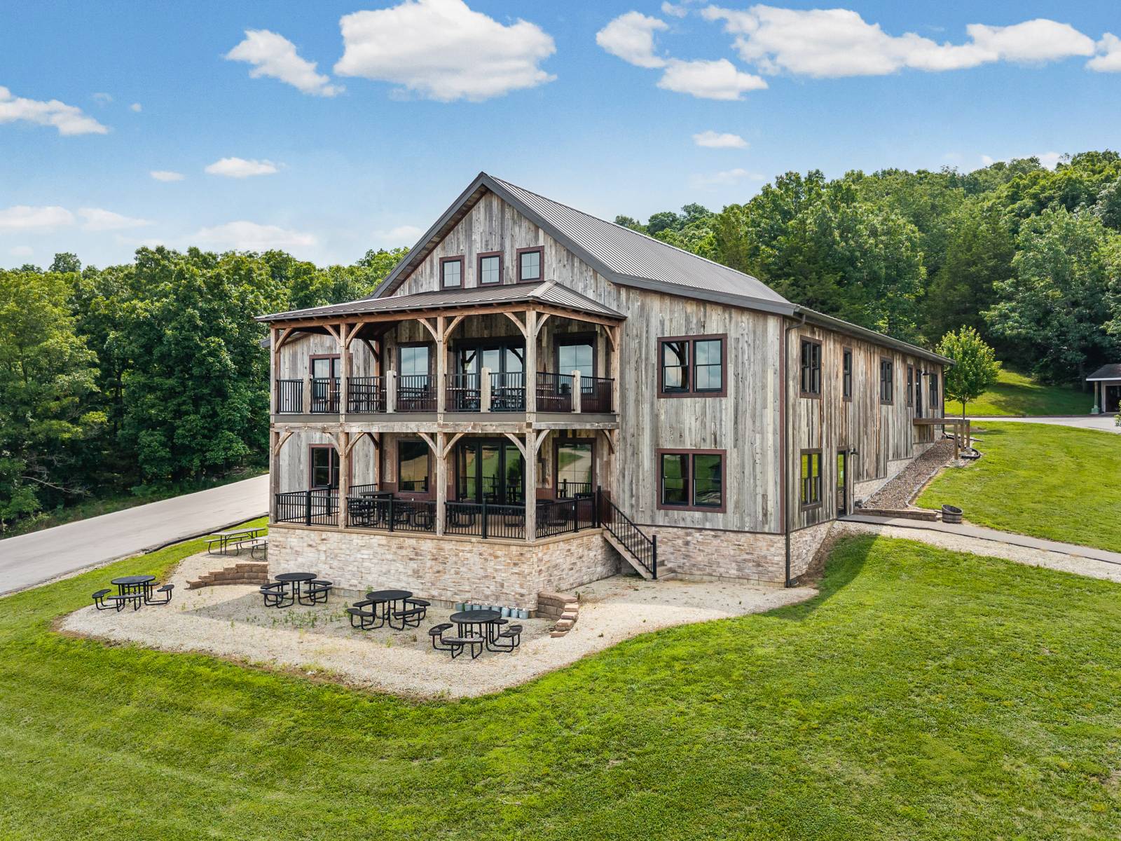 Reclaimed barn board siding • Post & beam two-story barn