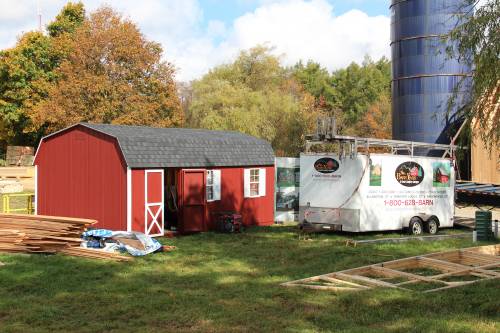 Dutch barn storage shed alongside crew trailer