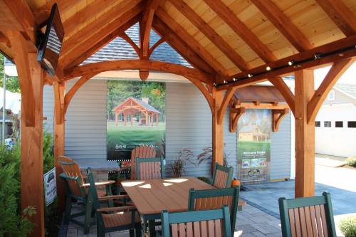 Under the shade of the timber frame pavilion at the Big E