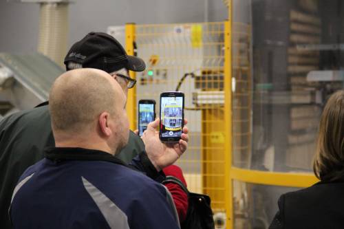 Onlookers capture the action on their phones