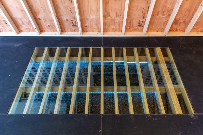 Super Floor System • 8" On Center Pressure Treated Floor Joists • Poly Armor Flooring
