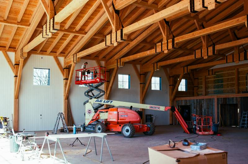 Nickel gap siding installed • Douglas Fir timbers remain exposed