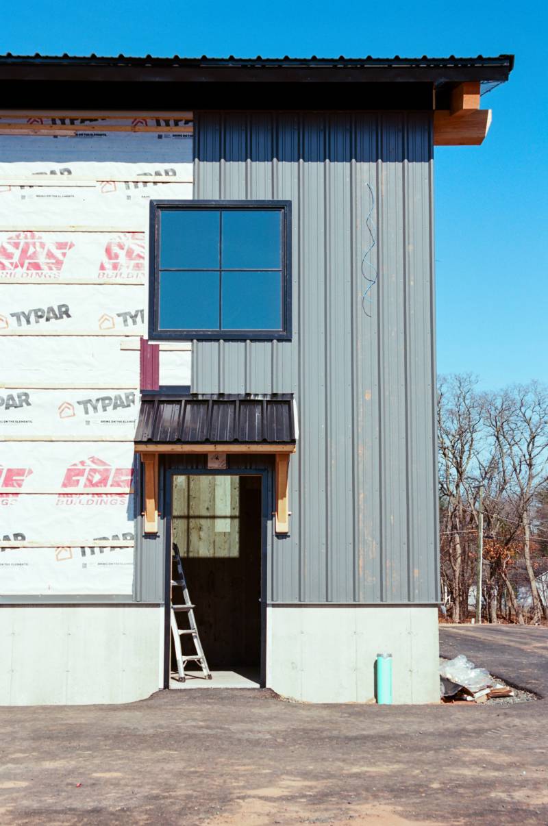 Adding the corrugated metal siding