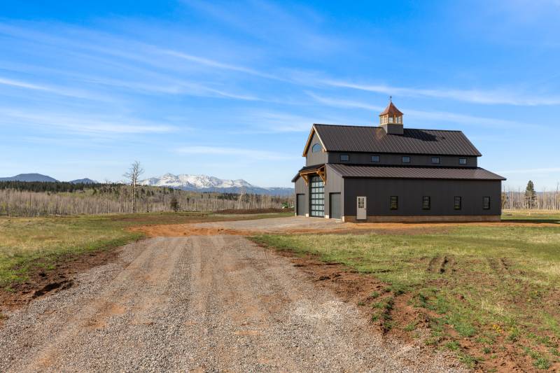 20' x 54' Center Aisle • 12' x 54' Enclosed Lean-to Overhangs • timber frame barn