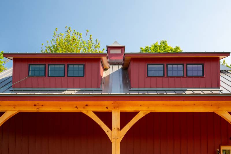 Another angle of the transom dormers • Timber Frame Barn Kit