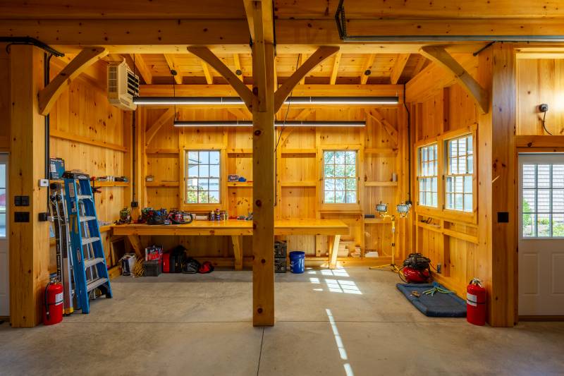 The enclosed post & beam lean-to has space for a workshop • barn living post & beam timber frame garage
