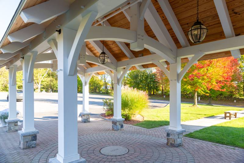 Rafters with scrolled ends for added detail • Post & beam pavilion