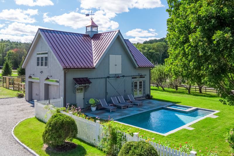 26' x 40' Carriage Barn with pine siding, sliding door, standard eyebrow roof, reverse gable dormer, and pine copper-top cupola with weathervane