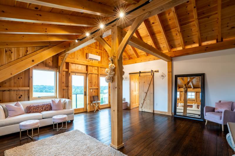 The bridal suite in the post & beam barn’s second floor loft