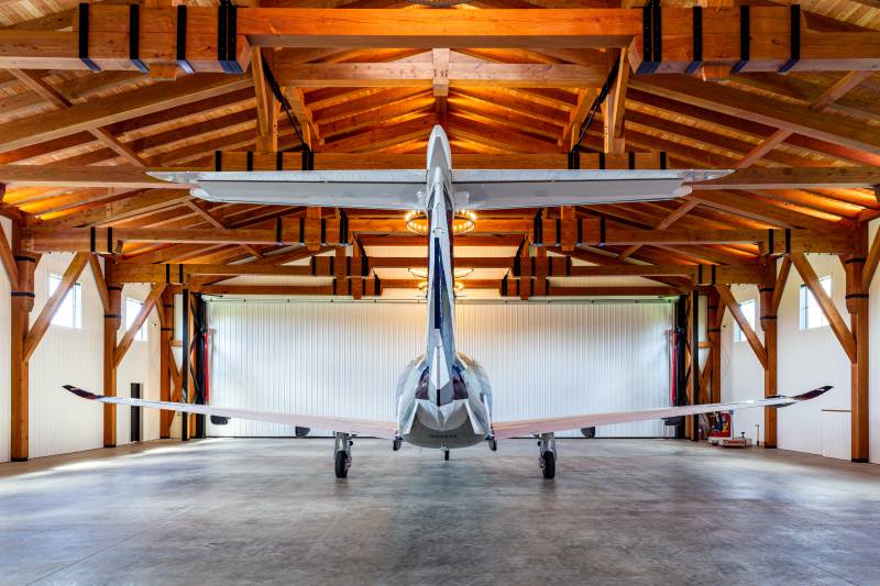 The plane exits through a 65' wide hydraulic tilt up door