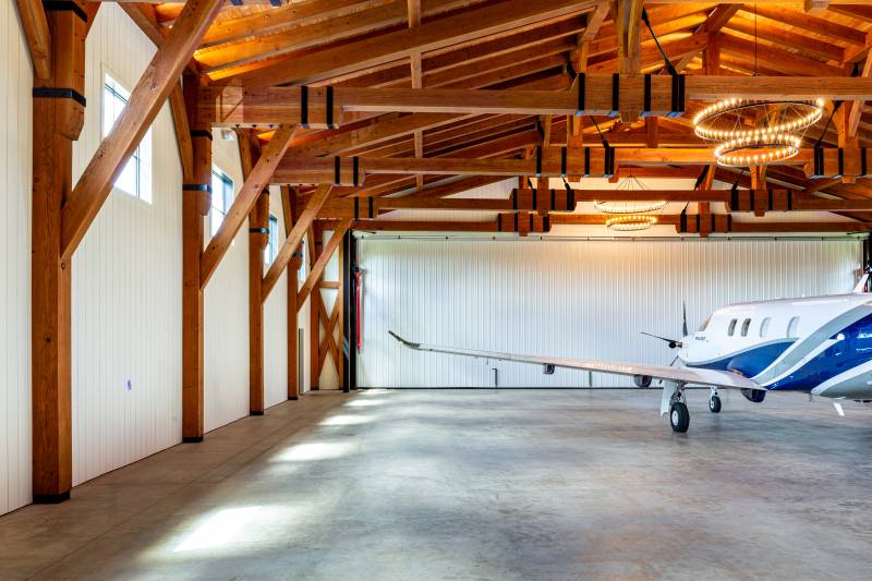 The plane’s 53' wingspan fits comfortably in the hangar