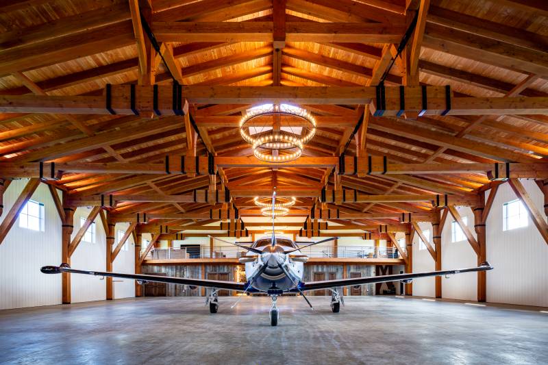 Custom timber frame airplane hangar for a Pilatus PC-12 NGX