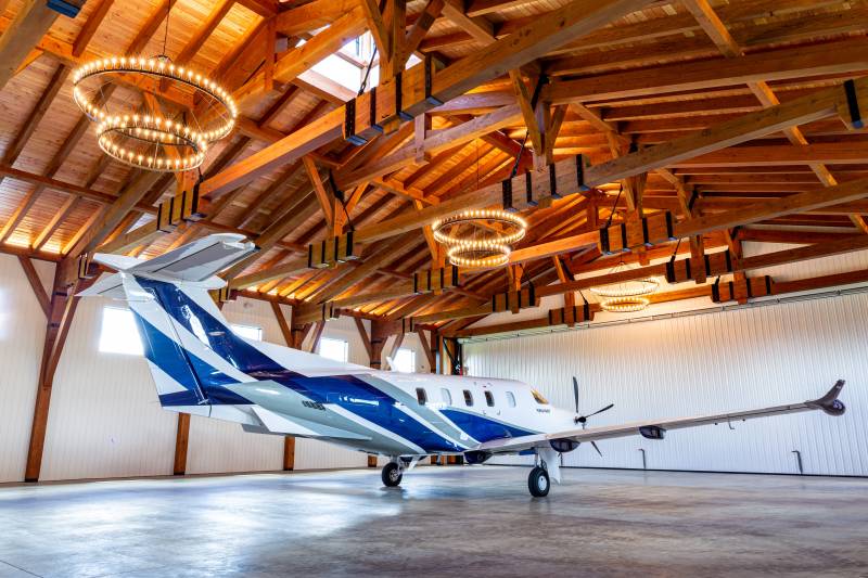 LED chandeliers & uplighting illuminate the timbered ceiling